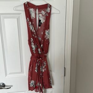 Lulus floral romper in paprika red with tie waist and pockets